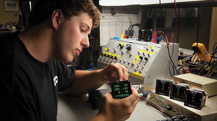 engineer working on assembling products